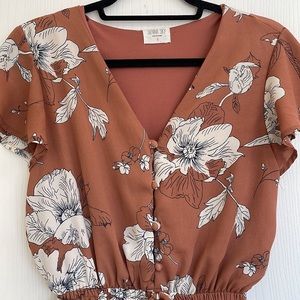 Sienna Sky rust colored floral romper w flutter sleeves and elastic waist